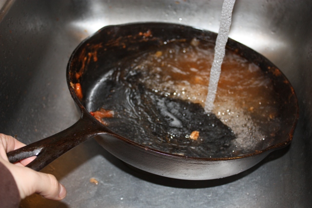 How do you clean a cast-iron pan?